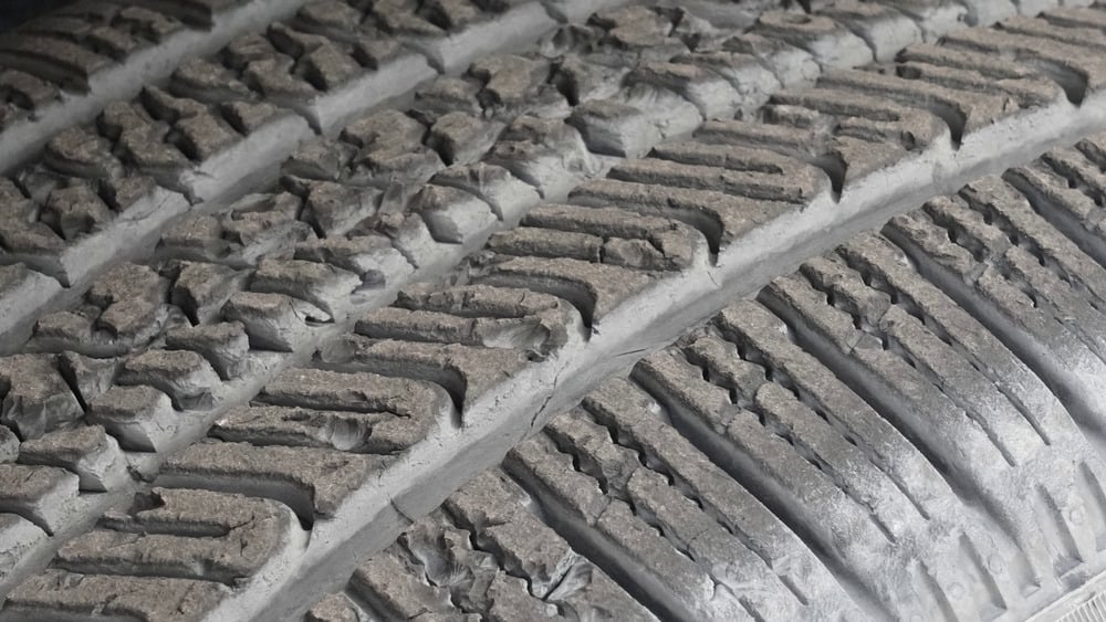 Close-up of chipped and torn tread blocks on the Pirelli Scorpion AS Plus 3 after off-road testing